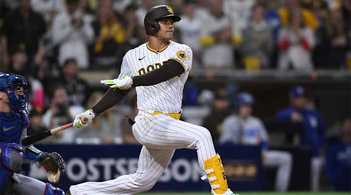 Oct 15, 2022; San Diego, California, USA; San Diego Padres right fielder Juan Soto (22) hits an RBI-single in the seventh inn against the Los Angeles Dodgers during game four of the NLDS for the 2022 MLB Playoffs at Petco Park.